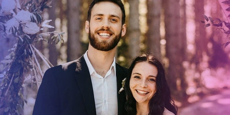 Lukas Dommer and Hannah Martin posing in a wooded area