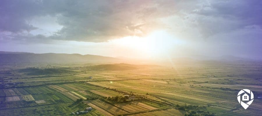 An image of land and rolling fields for the How to Flip Land Remotely from Spain blog.