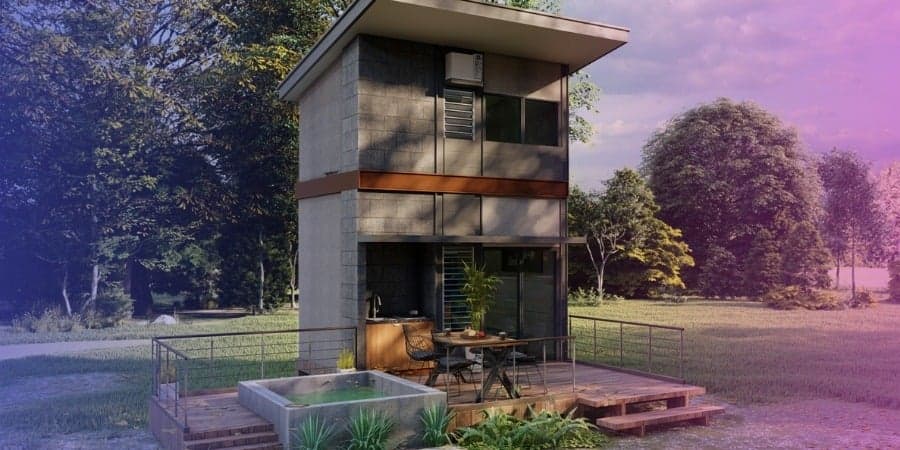 Two-story tiny home with a deck