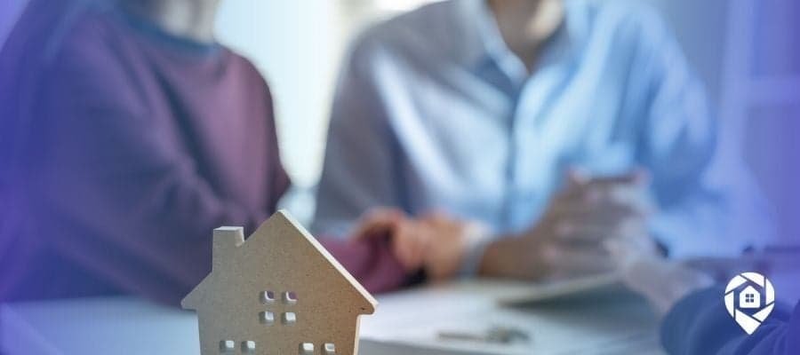 Real estate agent meeting with clients to build trust and long-term relationships in the Colorado housing market.