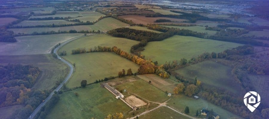 Aerial view of rural land ready for flipping, ideal for real estate investors exploring land investing strategies.
