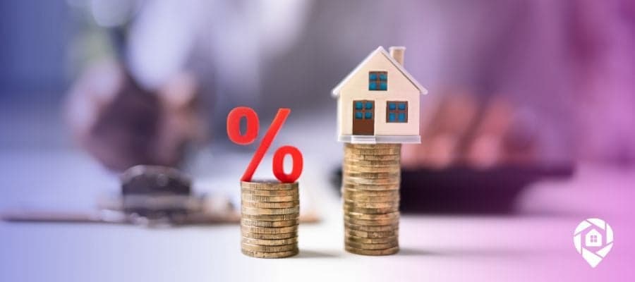 Percent sign on a stack of coins vs a house on a stack of coins to compare fixed rate vs adjustable rate mortgages.