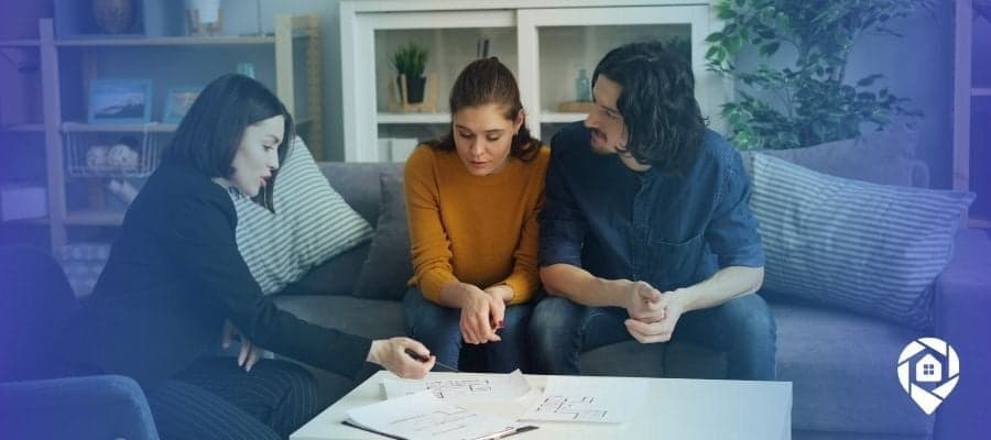 Young couple discussing real estate investment strategy with an advisor. Learning how to start investing with bad credit.