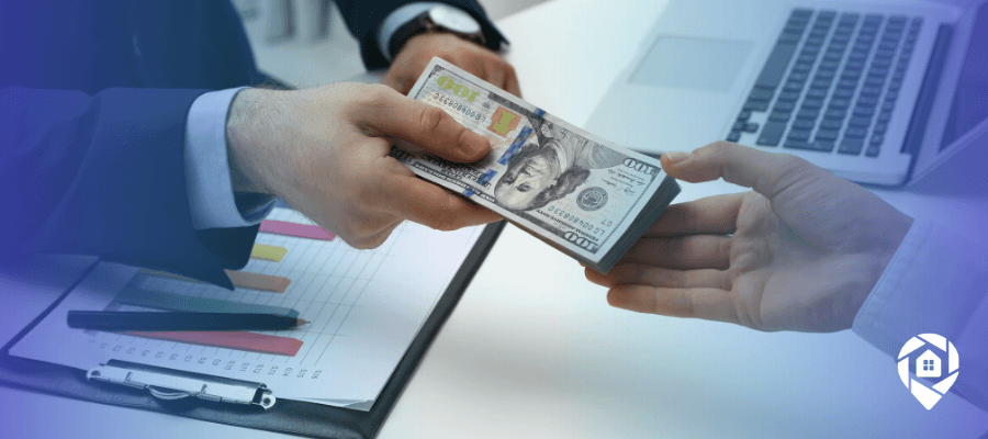 Private lender handing cash to real estate investor for property deal.