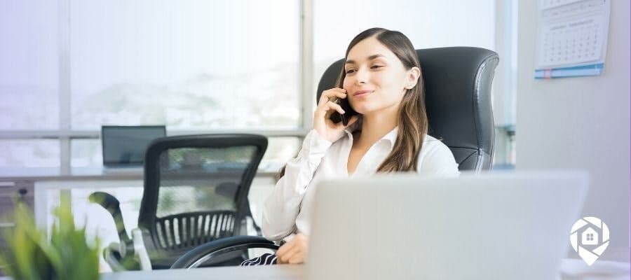 Real estate agent following up with a client on the phone.