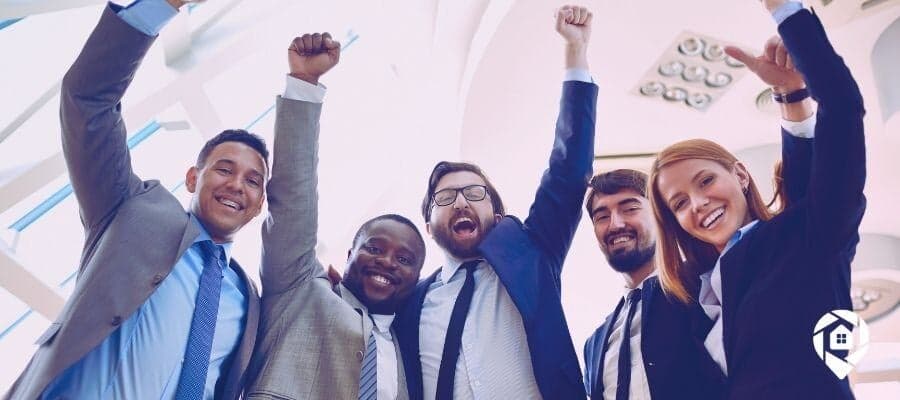 Successful real estate investors celebrating a big win.