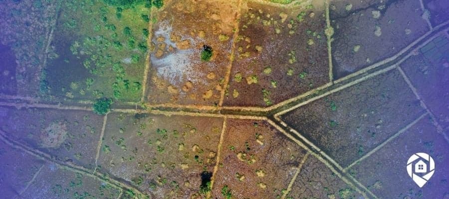 Aerial view of vacant land parcels used in high-volume land flipping operations across multiple states.