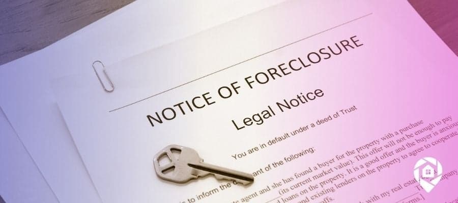 A key on top of a notice of foreclosure
