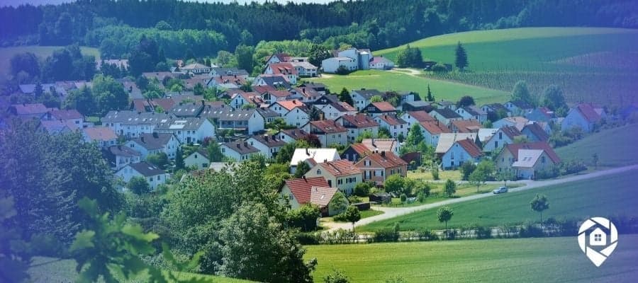 Aerial view of suburban homes symbolizing passive income through real estate investing.