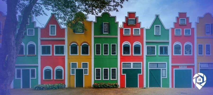 Colorful row houses representing rental property investment and real estate portfolio diversity.