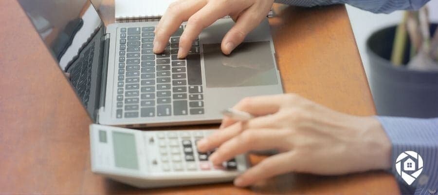 Real estate investor calculating property deals and profits.