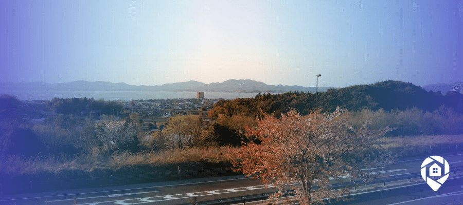 Scenic view of vacant land near a residential area, ideal for land wholesaling opportunities and virtual real estate investing.