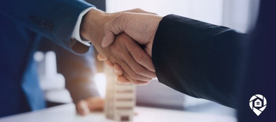 Real estate deal closed with a successful handshake.
