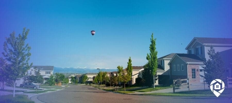 Suburban neighborhood street view used in real estate wholesaling for driving for dollars strategy.