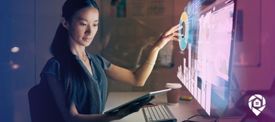 Woman at a computer with software popping off the screen for our real estate investing software blog.