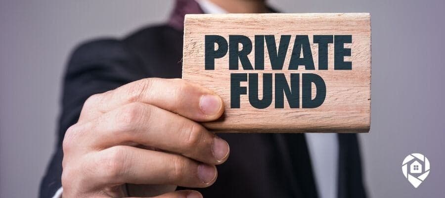 Businessman holding a wooden sign that says 'Private Fund' — representing private money lending for real estate investing.