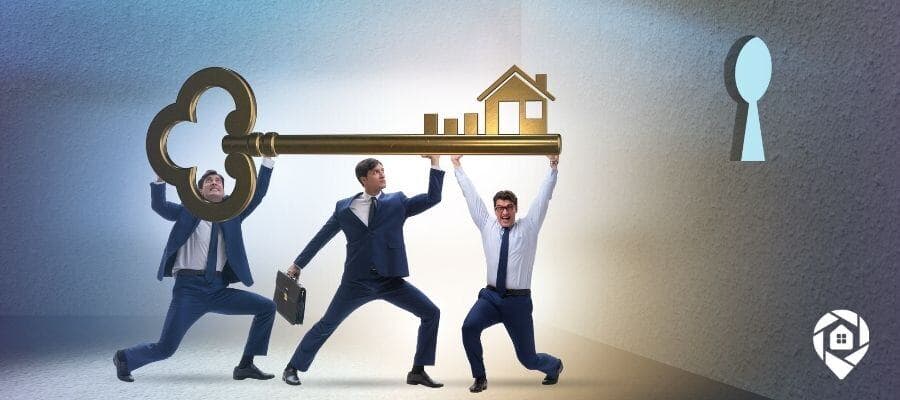 Real estate team unlocking success together with key symbolizing retention strategies.