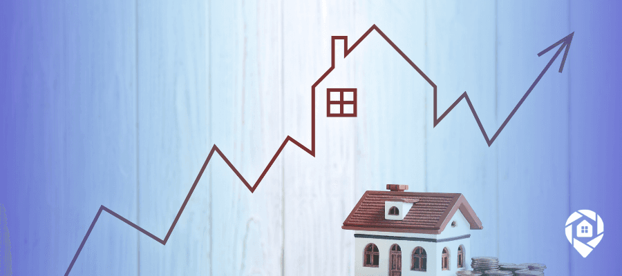 Real estate and inflation shown by a rising home-shaped trend line, a small house model, and stacked coins symbolizing property value growth.