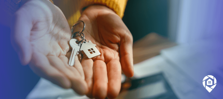 Homebuyer holding house keys, representing off-market deals and direct mail lead generation.