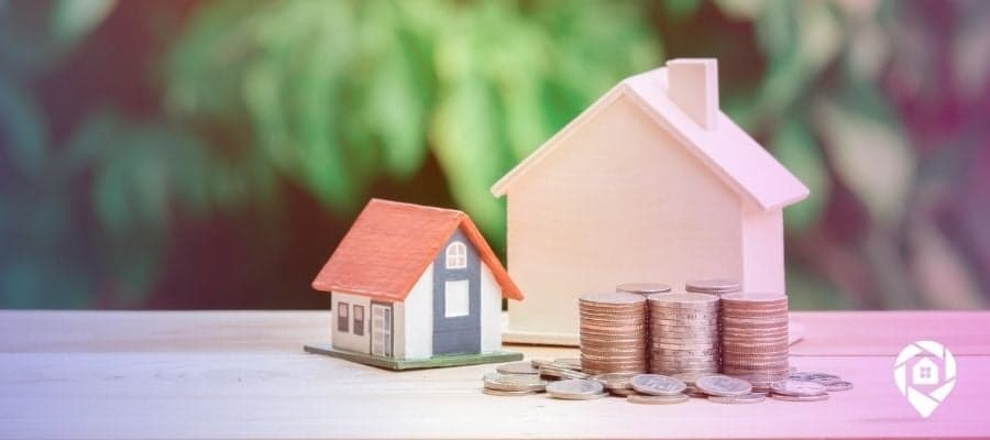 Properties with stacks of coins next to them for the taxes being collected on an investment property.