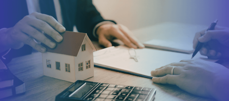 Person using a calculator to review home financing for a subject to a mortgage real estate deal.