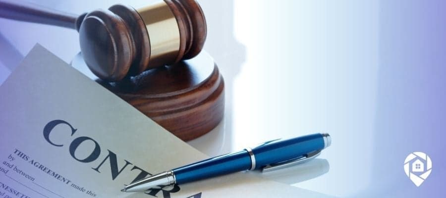 Real estate contract with pen and gavel – essential documents for wholesaling homes legally.