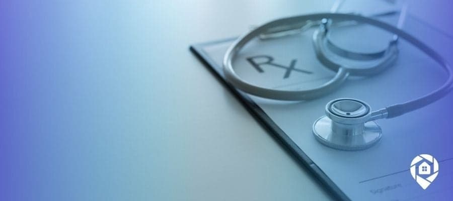 Stethoscope on medical chart symbolizing career change from medicine to real estate.