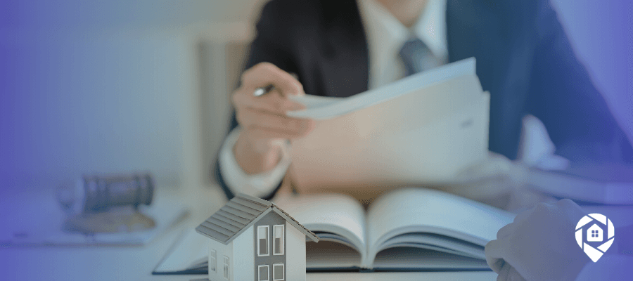 Disposition agent reviewing real estate documents during a wholesale property transaction.