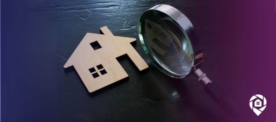 A house and magnifying glass looking into the trustworthiness of avm for real estate.