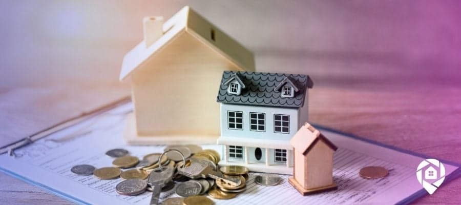 Houses with tax liens sitting on a table and clipboard.