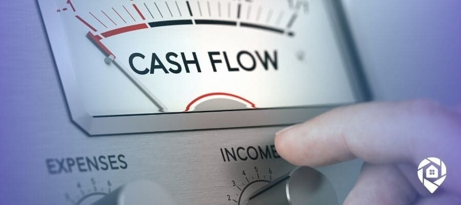 Real estate investor adjusting dial from expenses to income to increase property cash flow.